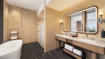 Deluxe Suite, 1 King Bed | Bathroom | Rainfall showerhead, hair dryer, bathrobes, slippers