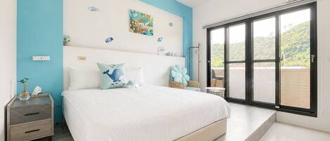 A bedroom with a bed, nightstands, a dresser, a window with a view, and a ceiling with a circular design.