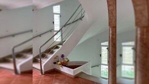 A modern interior with a staircase, white walls, and a tiled floor. - Spacious Villa near the Beach (Saidia)