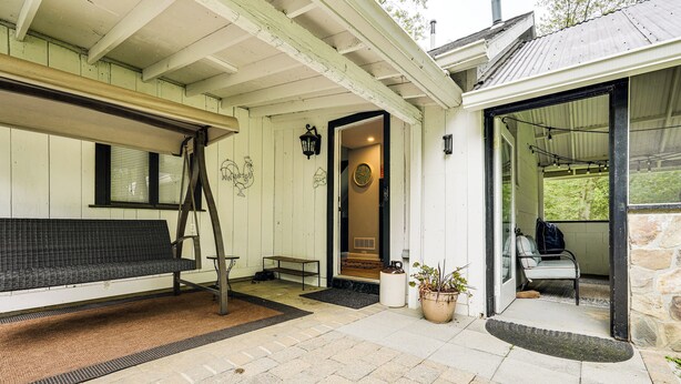 A covered porch with a bench, a ladder, and a potted plant. - Pet-Friendly Cottage, 2 Mi to Saugatuck Falls (Redding)