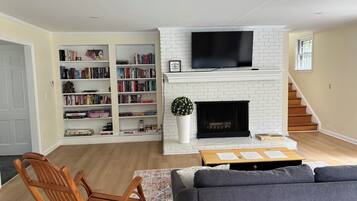 Smart TV, fireplace, table tennis, books