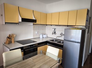 Apartment (One Bedroom Apartment with Sea View a) | Private kitchen | Fridge