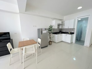 Suite, City View | Living area | 32-inch flat-screen TV with cable channels