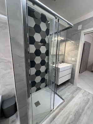 Shower, free toiletries, hair dryer, bathrobes
