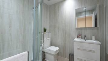 Shower, hair dryer, towels, soap