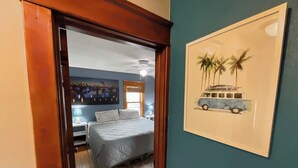A bedroom with a bed, a nightstand, a lamp, and a framed picture on the wall. - Charming 3 Bdrm by State Fair-Allianz Field -Como (Saint Paul)