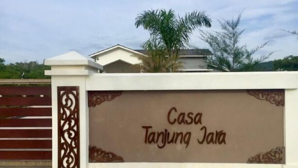A gated entrance with the text "Casa Tanjung Jaya" on a wall. - Casa Tanjung Jara (Kuala Dungun)