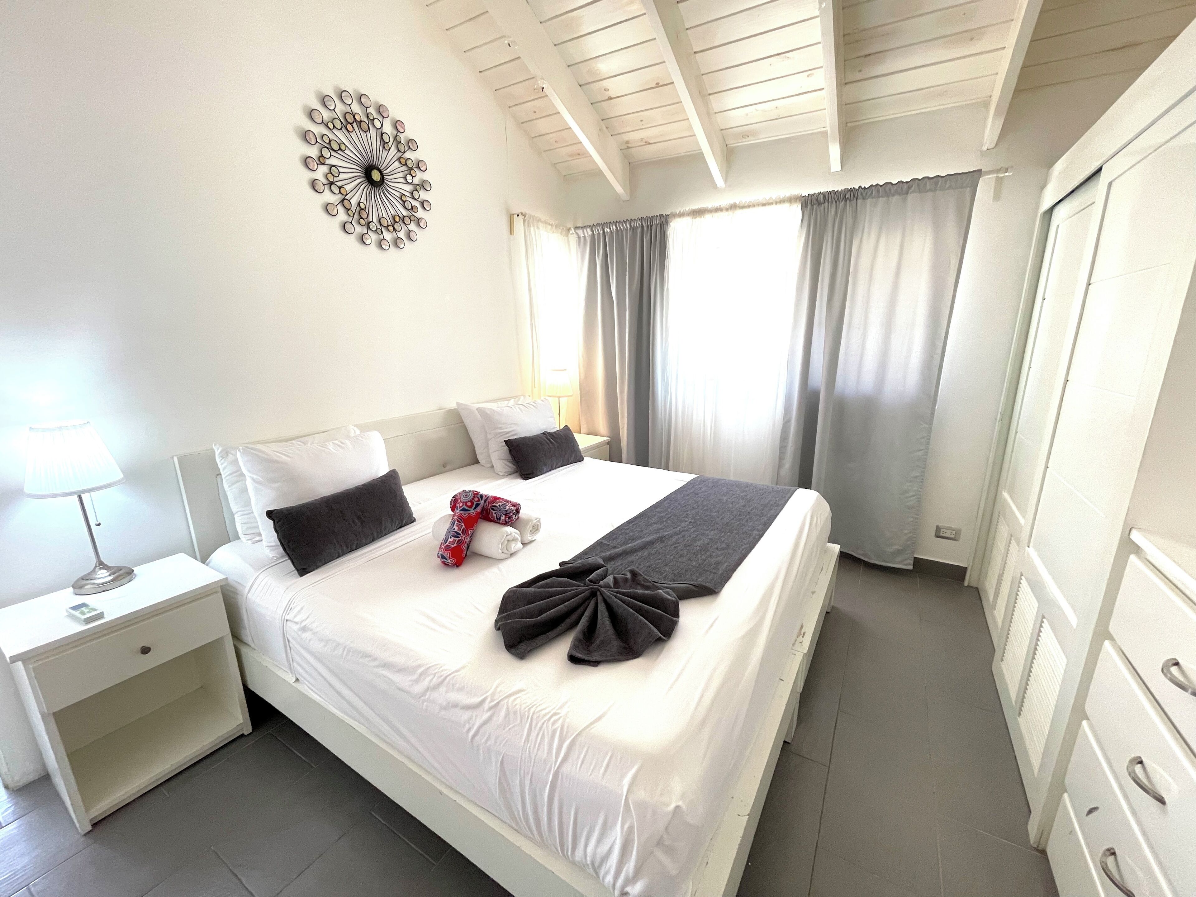 Exclusive Apartment, Ocean View | Down comforters, in-room safe, individually decorated