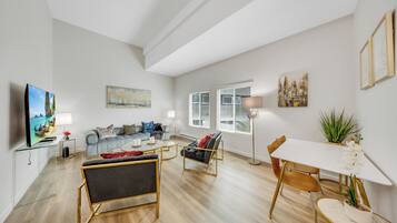 Superior Apartment, 3 Bedrooms | Living area | 55-inch LCD TV with digital channels