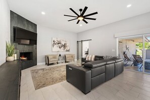 Smart TV, fireplace, books, printers