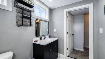 Shower, towels, soap, toilet paper