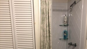 A bathroom with a shower, a toilet, and a sink. - Jersey Street Gem: Charming 1 Bedroom 1Bathroom (San Francisco)