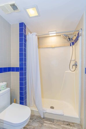 Shower, hair dryer, towels, shampoo