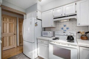 Fridge, microwave, oven, stovetop - 🌅 Lake Leelanau A-Frame – Waterfront • Sandy Bottom • Dock • Fireplace ➠ 7550 (Traverse City)