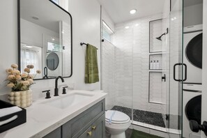 Shower, hair dryer, towels, soap
