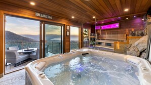 A hot tub in a wooden cabin with a view of a lake and mountains. - Tahoe Blue Estate Luxury Retreat LUXE5 (Stateline)