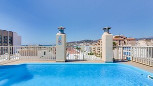 A rooftop pool with a clear view of the surrounding buildings and landscape. - Apartamentos Solset Nerja C (Nerja)