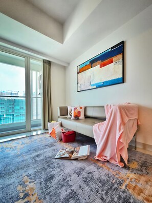 Apartment, 1 Bedroom, City View | Living area | 43-inch Smart TV with cable channels - Kenzi By SanLiving - 2BR - Kelapa Gading (Jakarta)