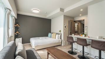 Deluxe Double Room, Balcony | Living area | 55-inch LCD TV with satellite channels