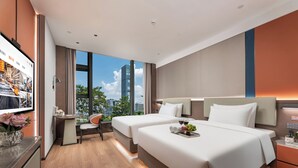 A modern hotel room with two beds, a desk, and a view of the city. - From·K Hotel Pazhou (Guangzhou)