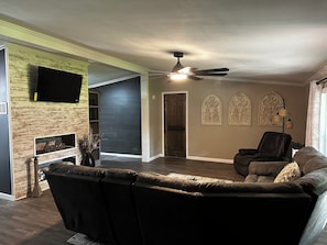 Smart TV, fireplace, table football, books