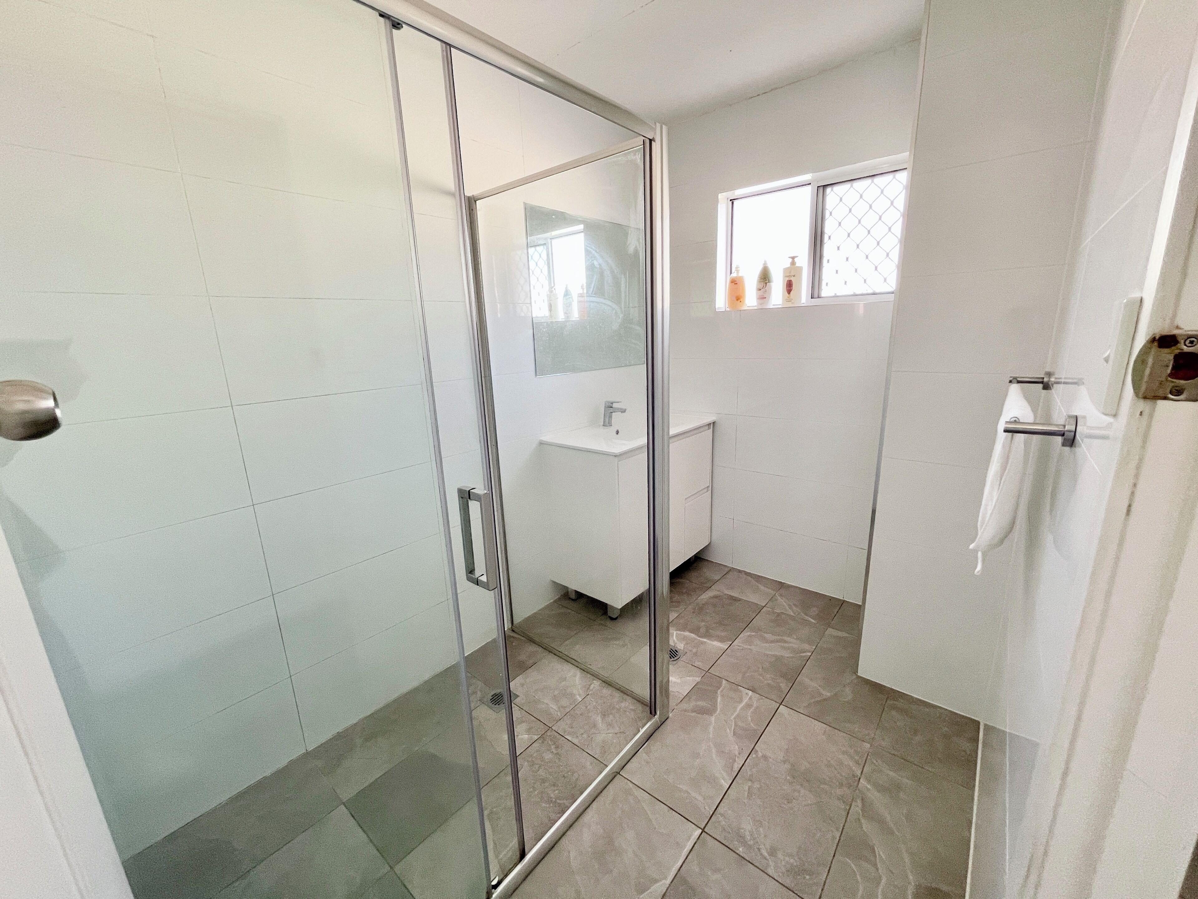 Shower, hair dryer, towels, toilet paper