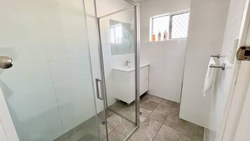 Shower, hair dryer, towels, toilet paper
