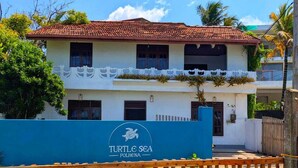 A two-story building with a tiled roof and a sign reading "Turtle Sea Polhona". - Delightful 5-bedroom apartment in Matara (Matara)