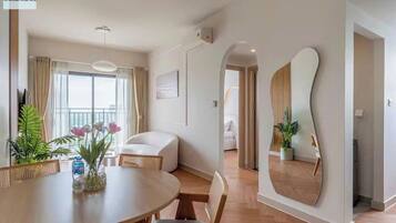 Deluxe Apartment, 1 King Bed, Non Smoking, City View | Living area | 16-inch TV with digital channels