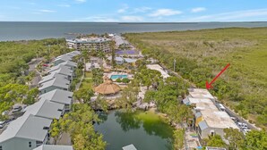 A resort with multiple buildings, a swimming pool, and a beach area. - Suntastic -  Salt Water Lagoon Front 2 Bedroom in popular OCEAN FRONT Kawama (Key Largo)