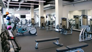 A gym with various exercise equipment, including dumbbells, treadmills, and weight machines. - Terminal Tower! Dwntwn, Stadium, Casino, R&RHoF (Cleveland)