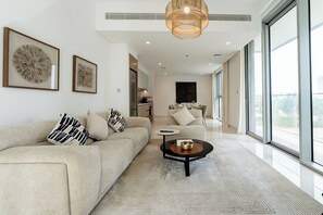 Superior Apartment, Balcony, Sea View | Living area | 55-inch Smart TV with digital channels