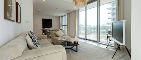 Superior Apartment, Balcony, Sea View | Living area | 55-inch Smart TV with digital channels