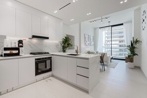 Deluxe Apartment, Balcony, City View | Private kitchen | Espresso maker, electric kettle - Binghatti Amber Residences- JVC (Dubai)