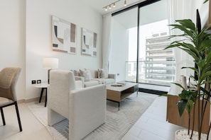 Deluxe Apartment, Balcony, City View | Living area | 55-inch Smart TV with digital channels