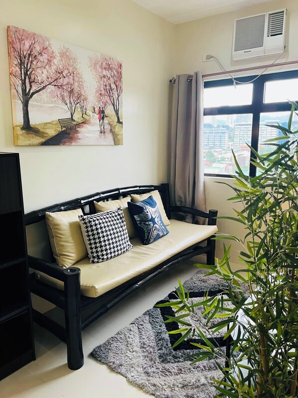 Living area - Cozy 1-bedroom condo with AC, fitness room in charming Mandaue Cebu Ph (Mandaue)