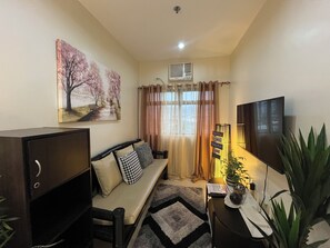 Living area - Cozy 1-bedroom condo with AC, fitness room in charming Mandaue Cebu Ph (Mandaue)