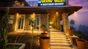 A boutique resort with a stone facade, a signboard, and a staircase leading to the entrance. - Grand Valley - A boutique Resort in Mount Abu (Mount Abu)
