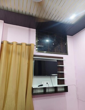 Habitación Deluxe, Aire acondicionado | Escritorio, camas supletorias, wifi gratis y ropa de cama