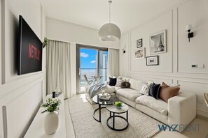 Luxury Apartment, Balcony, City View | Living area | 55-inch Smart TV with digital channels, streaming services