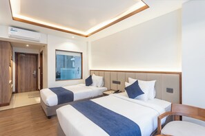 Deluxe Twin Room, Balcony, City View | In-room safe, desk, laptop workspace, iron/ironing board