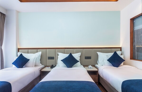 Deluxe Triple Room, Balcony, City View | In-room safe, desk, laptop workspace, iron/ironing board