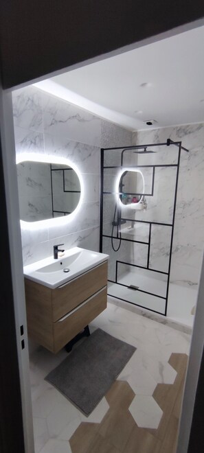 Shower, towels, soap, toilet paper