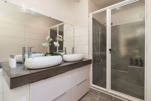 Shower, hair dryer, towels, soap