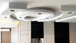 A modern ceiling with recessed lighting and a circular design element. -  Arjan Park alkhalij (Riyadh)