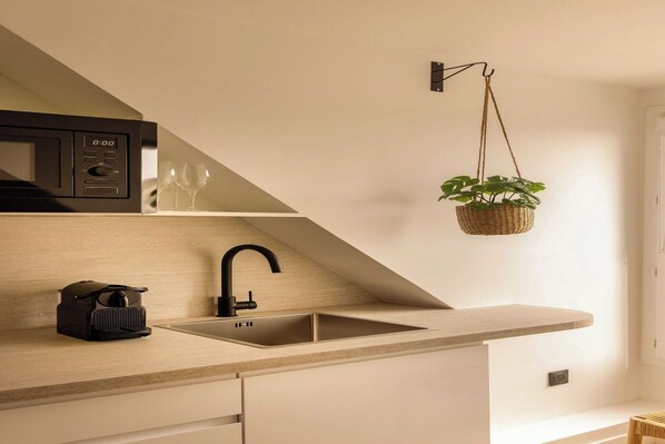 Fridge, microwave, stovetop, coffee/tea maker