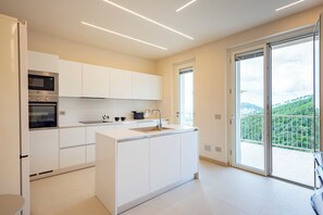 Family Apartment, 3 Bedrooms, Mountainside (Relais Le Torri in Verici Mustafa) | Private kitchen | Fridge, microwave, oven, stovetop