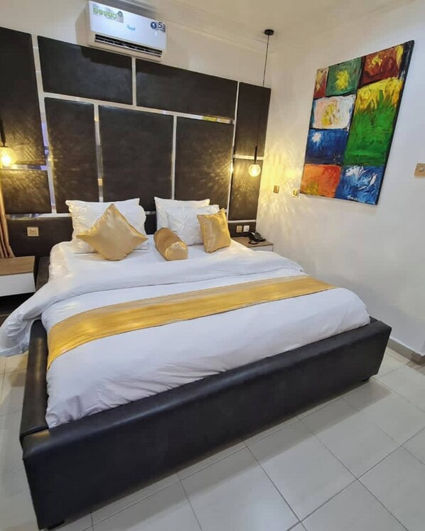 Deluxe Apartment, Balcony, City View | In-room safe, desk, laptop workspace, iron/ironing board