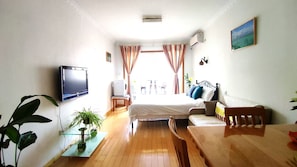 Premium bedding, laptop workspace, blackout curtains, soundproofing
