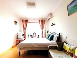 Premium bedding, laptop workspace, blackout drapes, soundproofing